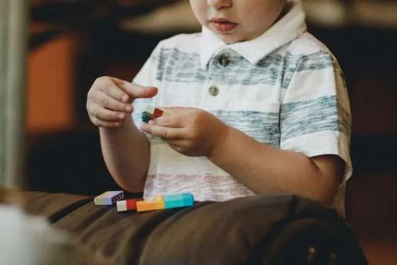 A child playing with lego