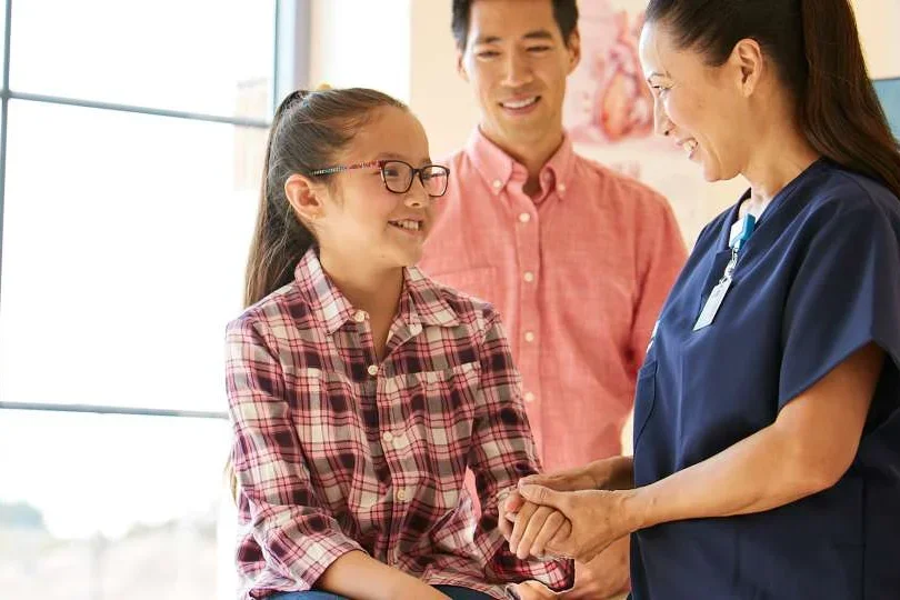 Parent and his child with child's doctor