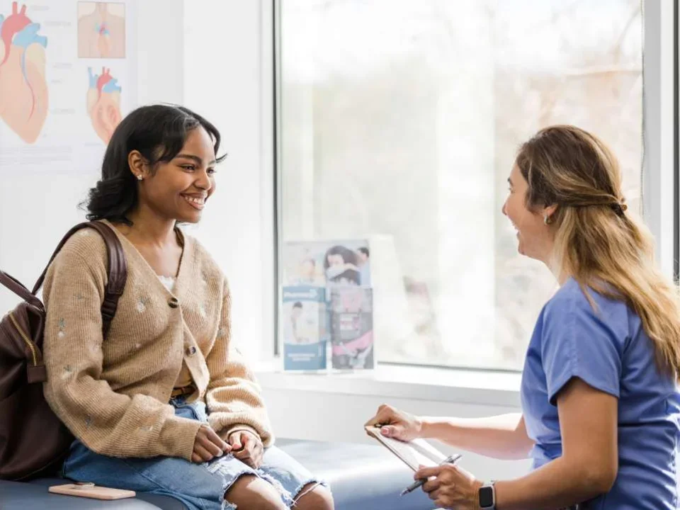 Doctor talking to teen