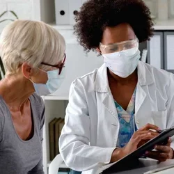 A doctor talking to a patient